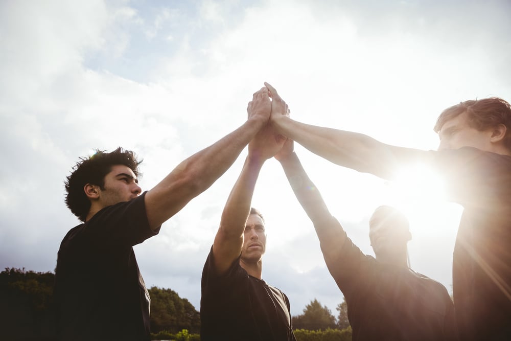 Rugby players standing together before match at the park